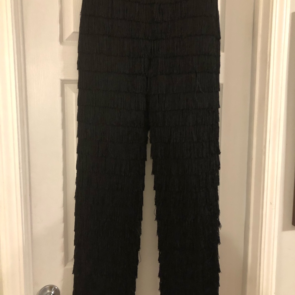 We’re absolutely obsessed with The AKIRA Label Best Ever Fringe Pant in Black.